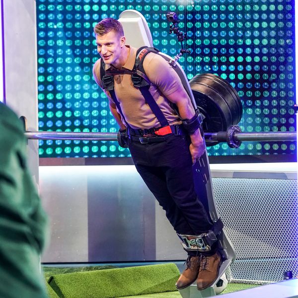 Gronk is strapped into a giant foosball game to serve as goalie
