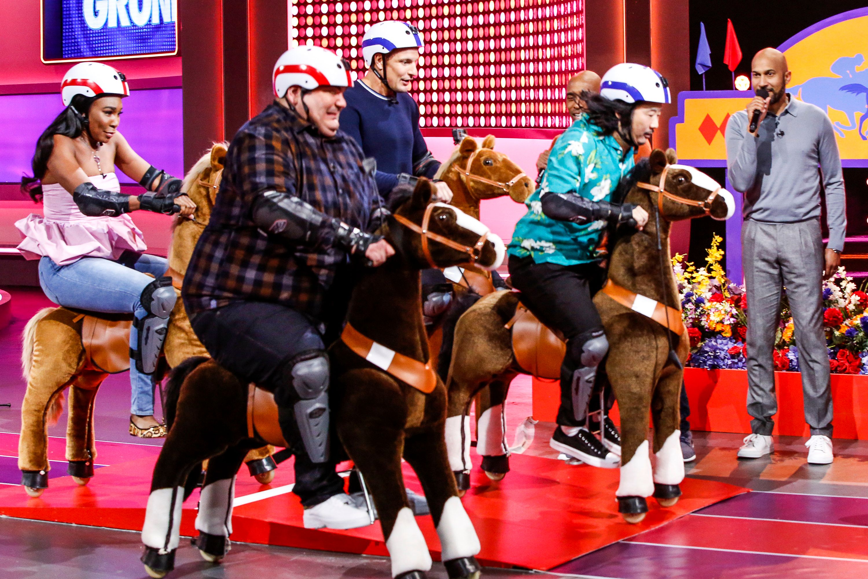 Gronk and the Game On regulars race plush mechanical horses around the set