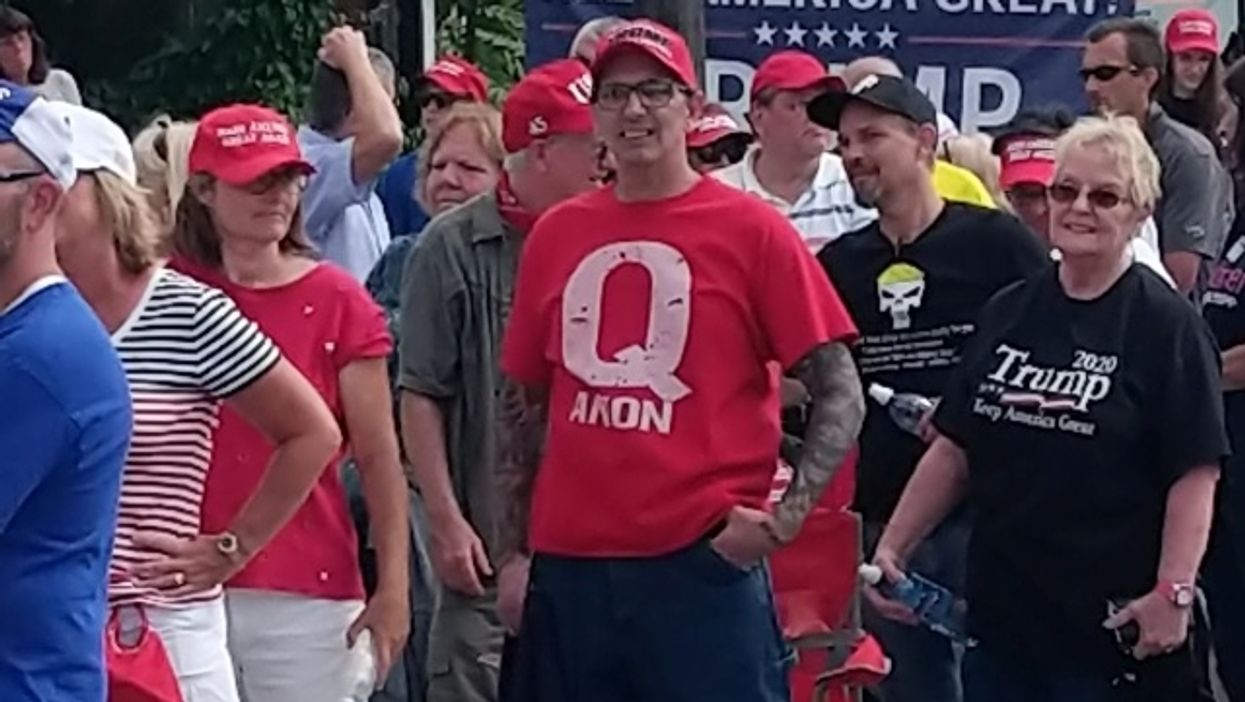 Man in QAnon shirt at a Trump event.