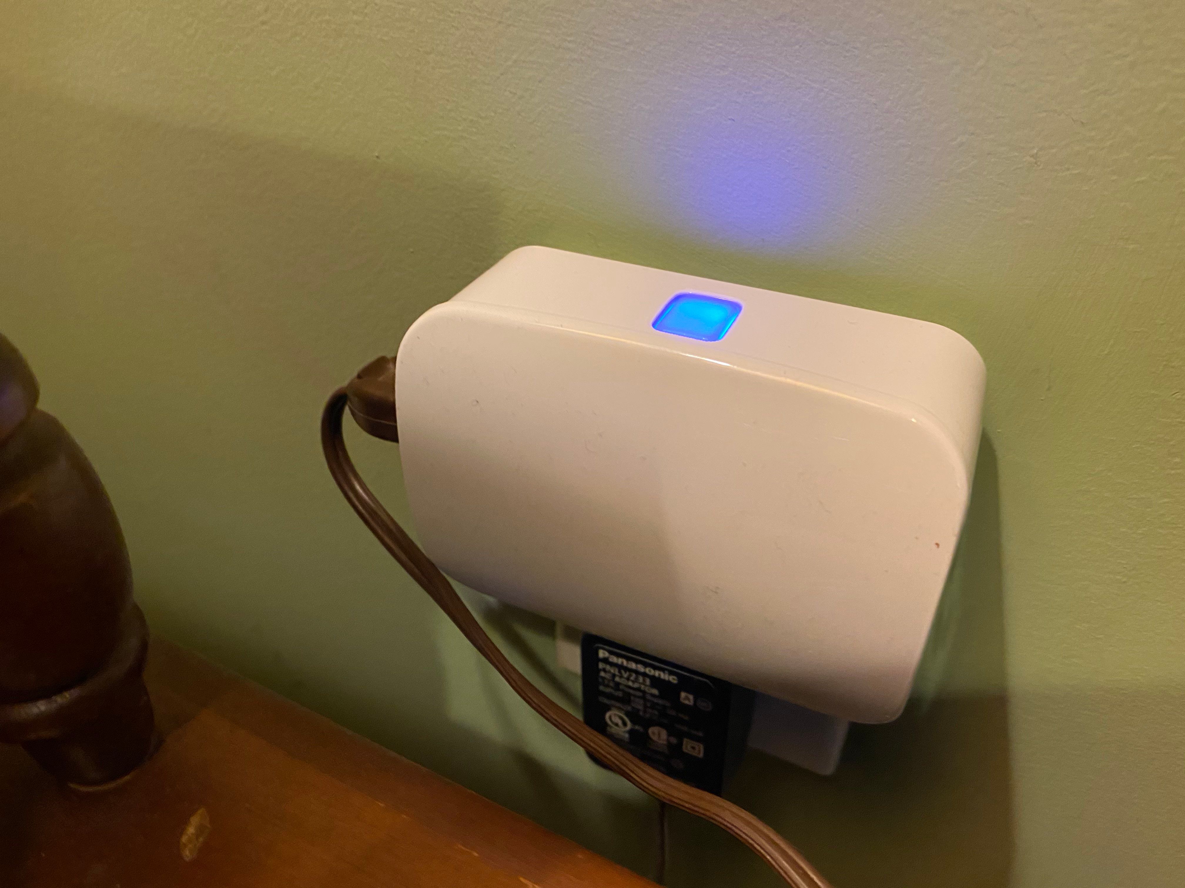 The Enbrighten Plug-in Zigbee Smart Switch plugged into a wall outlet