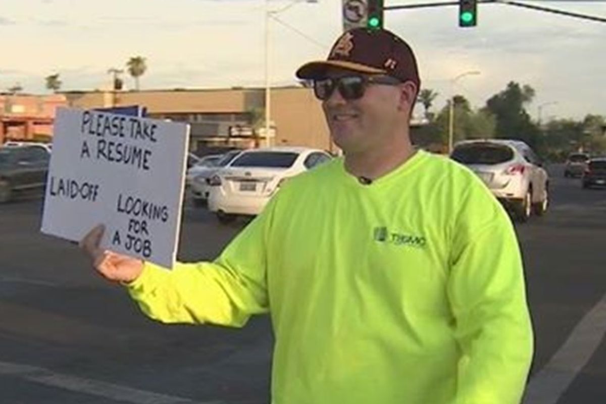 Laid off dad gets a new job after handing out hundreds of resumes to strangers on the street
