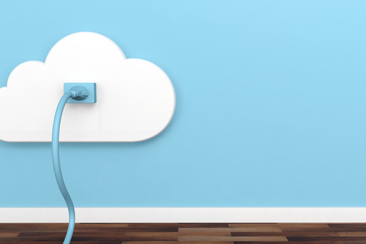 A smart plug on a blue wall