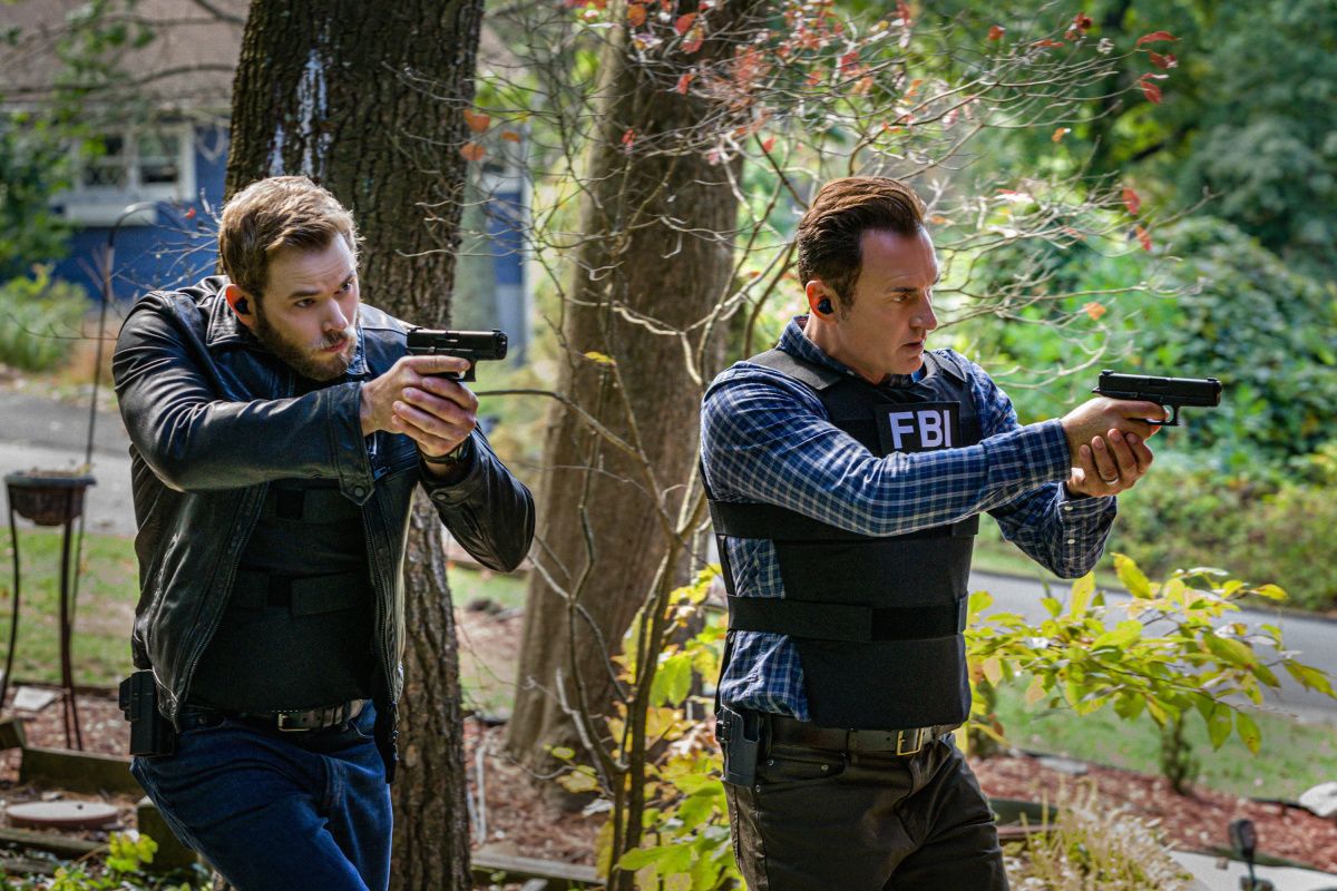 Special agents holding guns