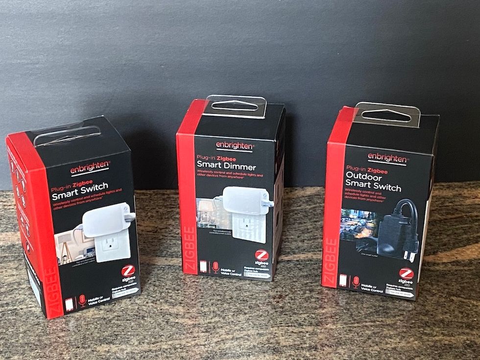 photo of jasco enbrighten smart plugs for Zigbee connection on a counter.
