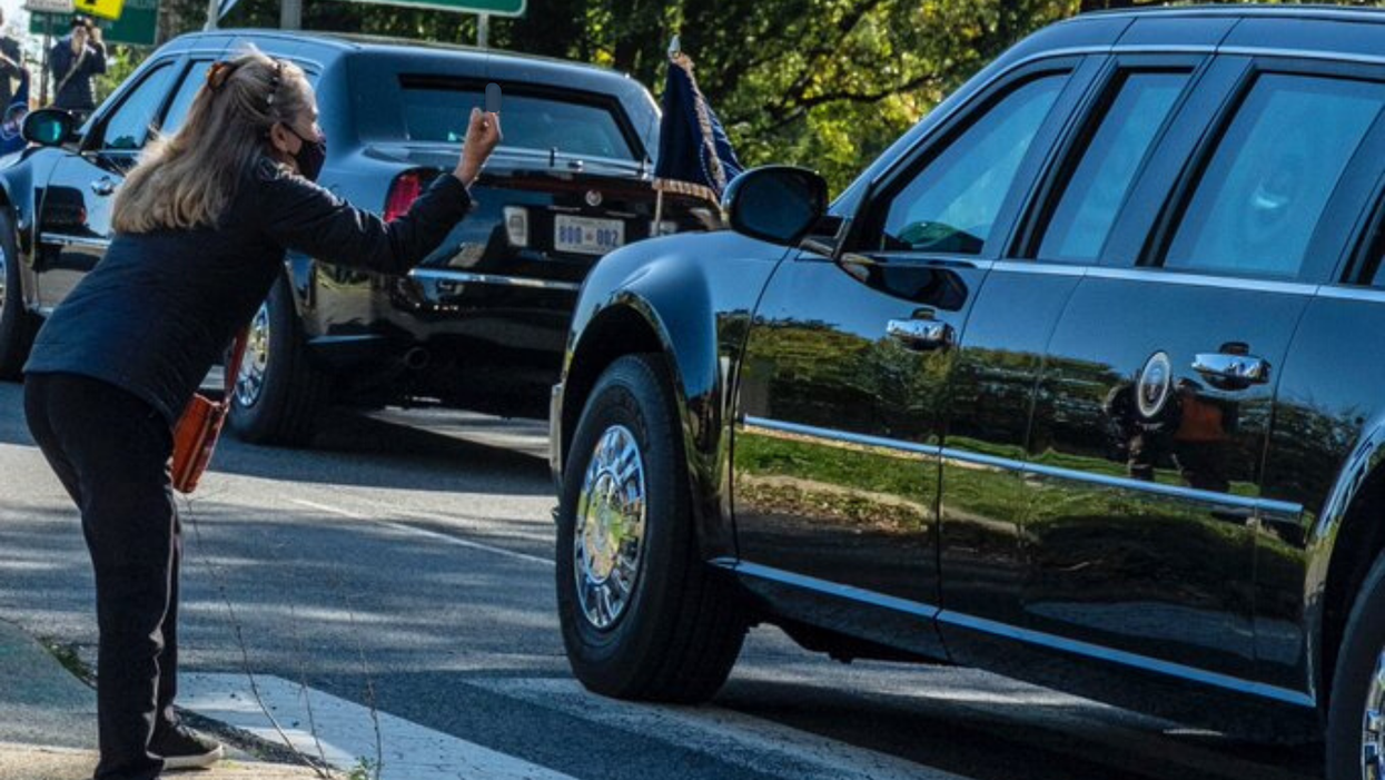 Photo Of Woman Flicking Off Trump On Election Day Goes Viral