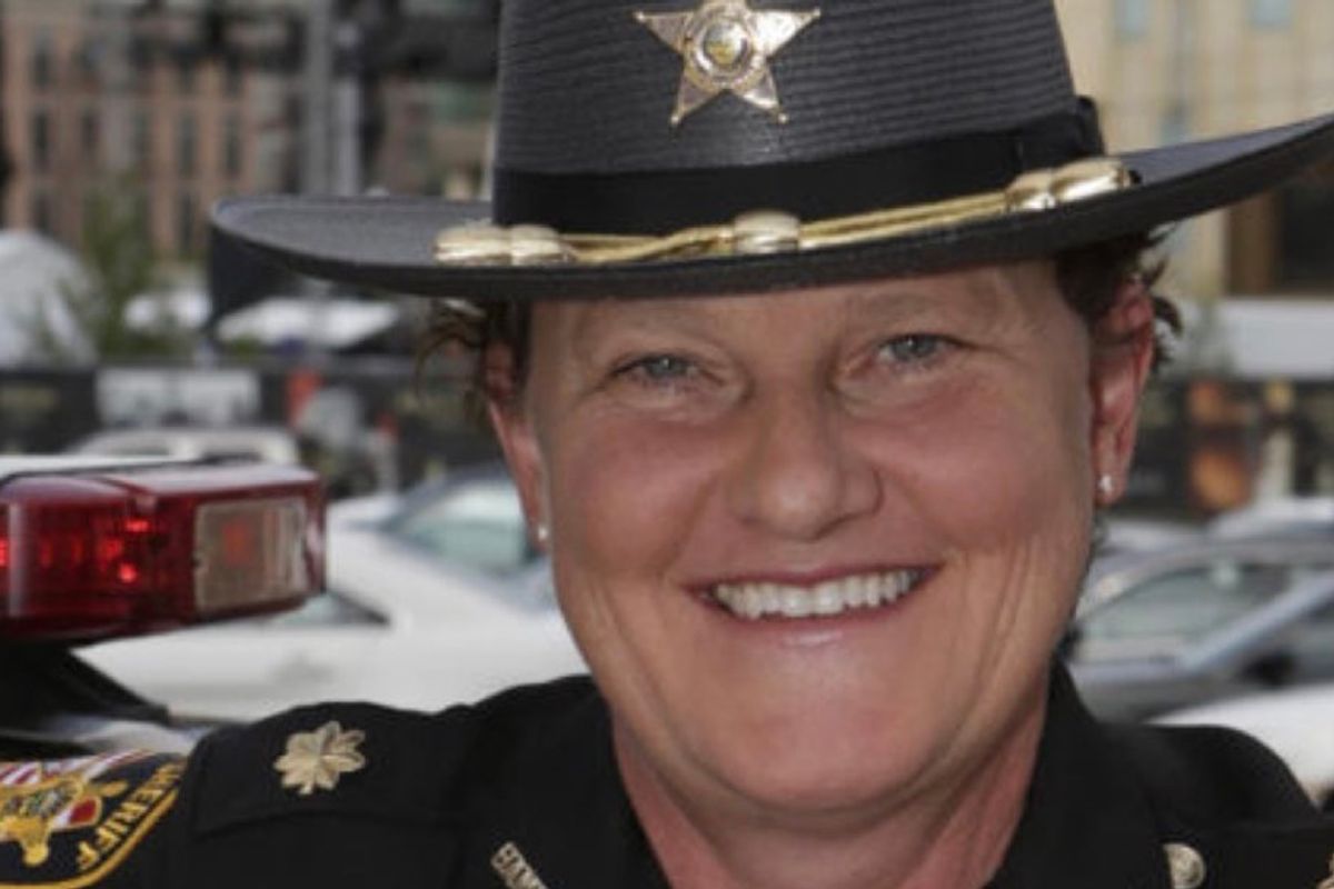 She was fired by the sheriff for being a lesbian. So, she ran for his job and beat him.