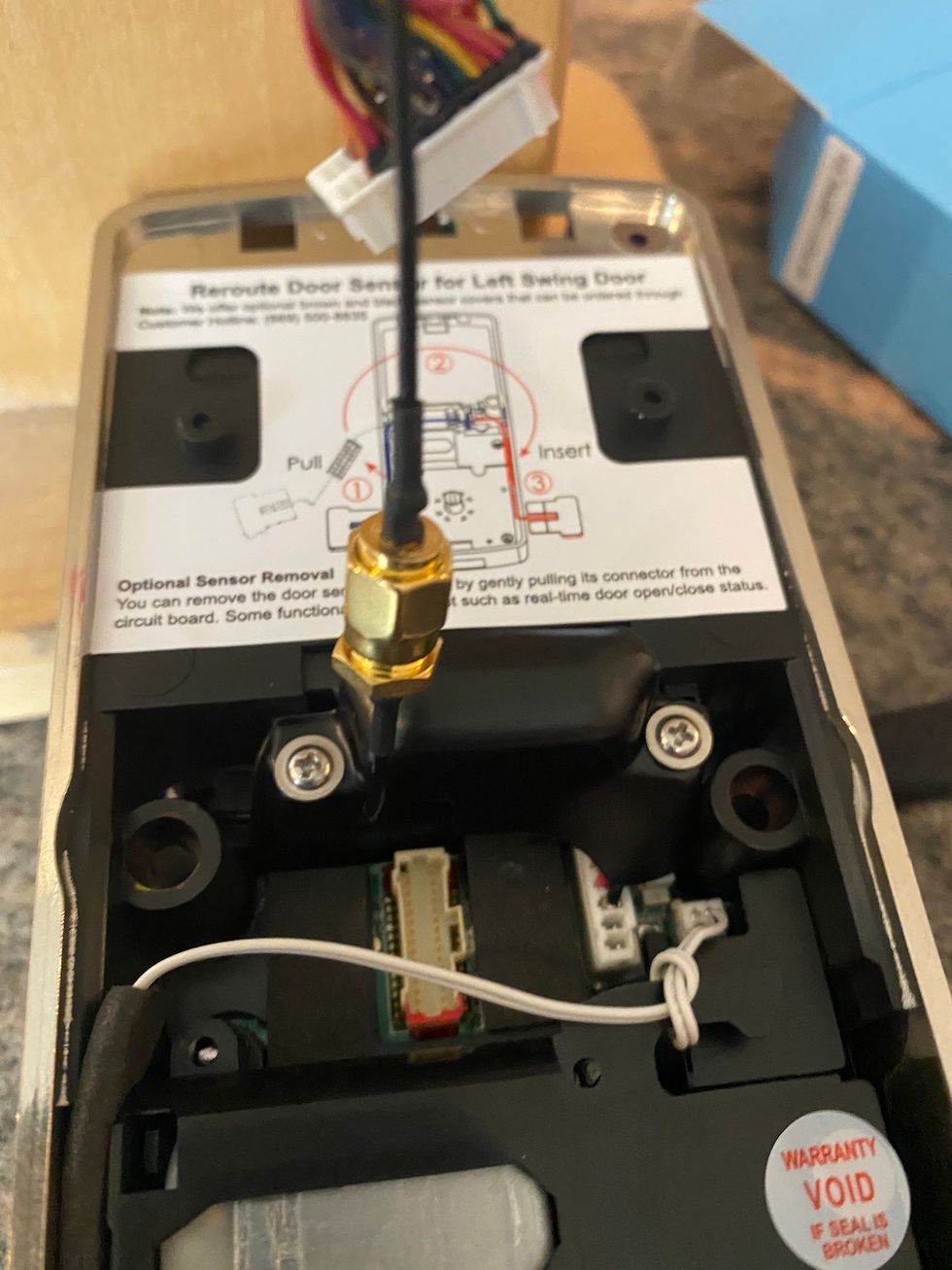 photo of cables inside the back of Lockly Vision which are hard to seal.