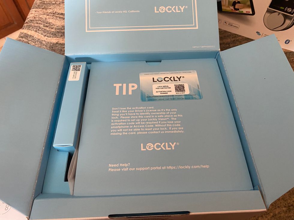 Photo of inside Lockly Vision box with activation code