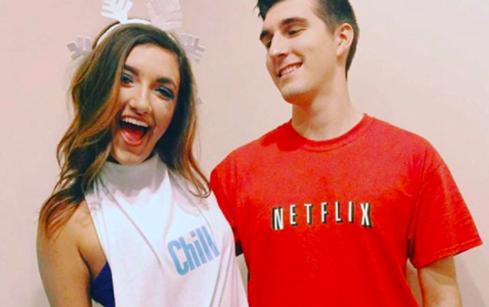 couple standing next to each other with one wearing tshirt that says "chill" and the other wearing one that says "netflix"