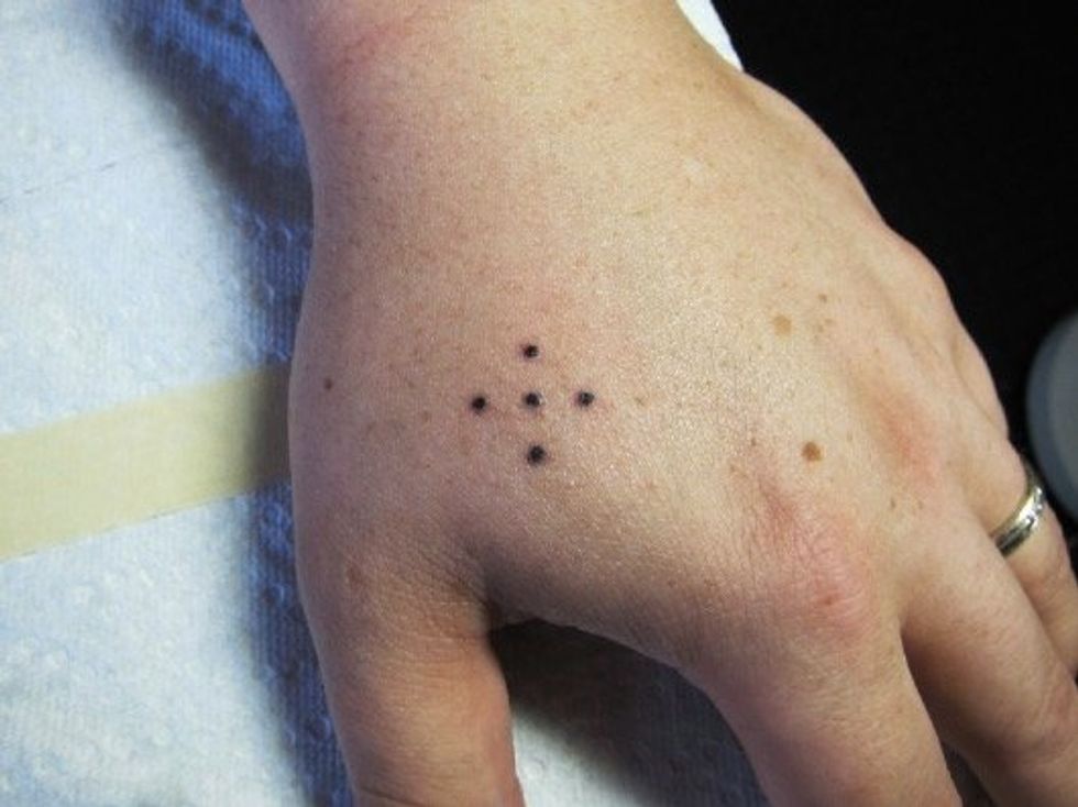 Five dots tattoo