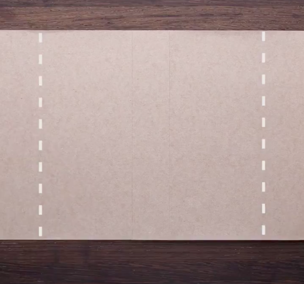 Cardboard with two dotted white lines down the sides