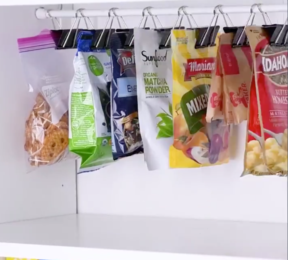 Bags are clipped into the binder clips to hold them neat and closed