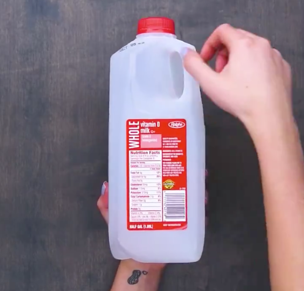 An empty half-gallon of milk