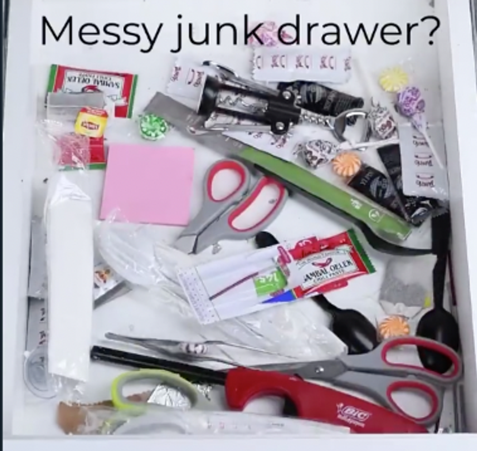 A drawer full of mess and miscellaneous items