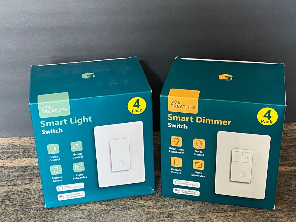 TreatLife Smart Light Switch and Dimmer Switch on a counter