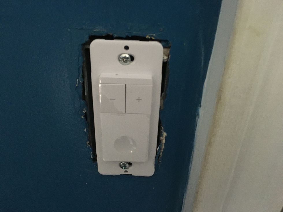 TreatLife Dimmer Switch installed in the wall.
