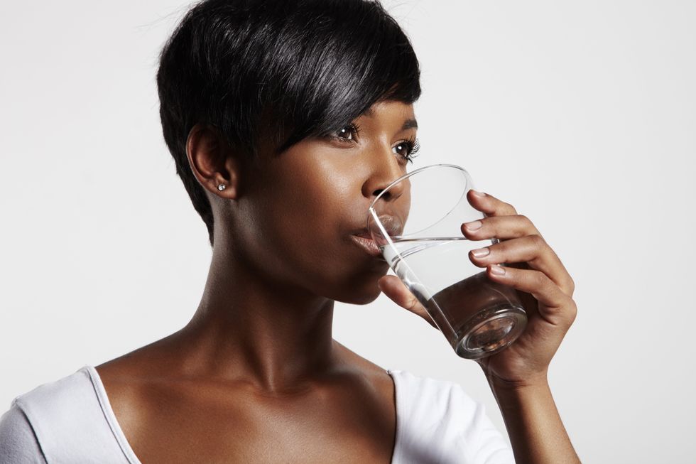 black girl drinking water