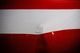 A person touches Peru's national flag after Francisco Sagasti from the Centrist Morado Party was elected Peru's interim president by Congress, in Lima