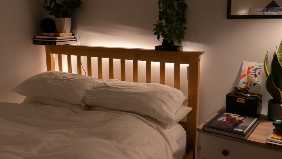 Hue light strip fitted to the headboard of a bed