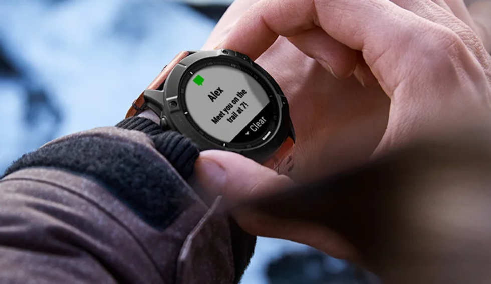 A man's wrist with Garmin Fenix 6X Pro Smartwatch