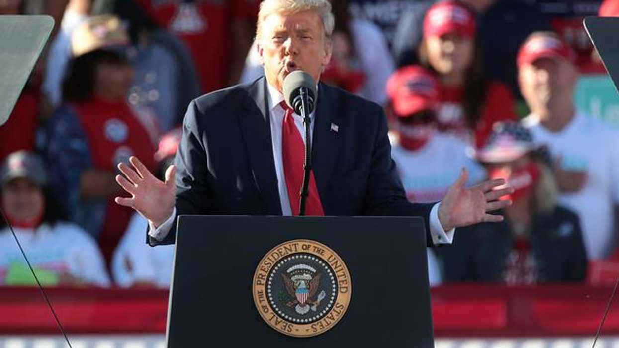 Trump speaking at rally.
