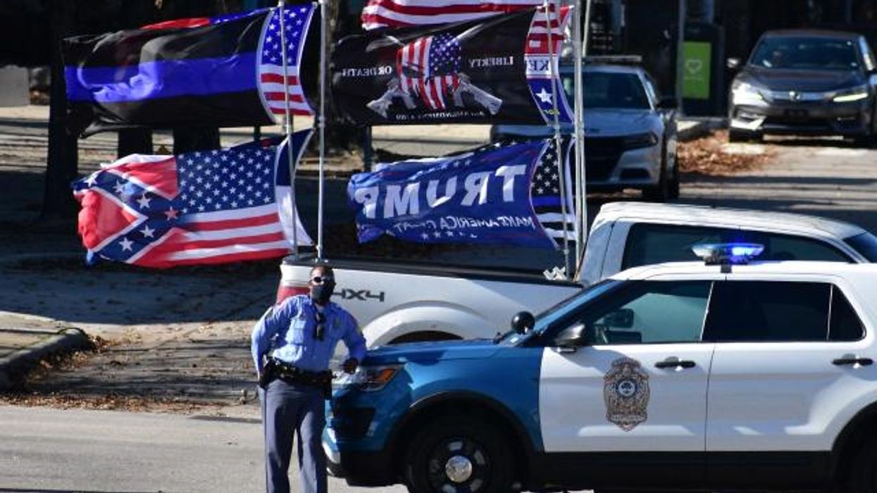 Pistols, Pickup Trucks And Trump Flags: How Voter Intimidation Invaded Polling Sites