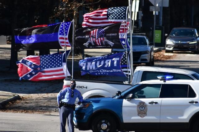 Pistols, Pickup Trucks And Trump Flags: How Voter Intimidation Invaded Polling Sites