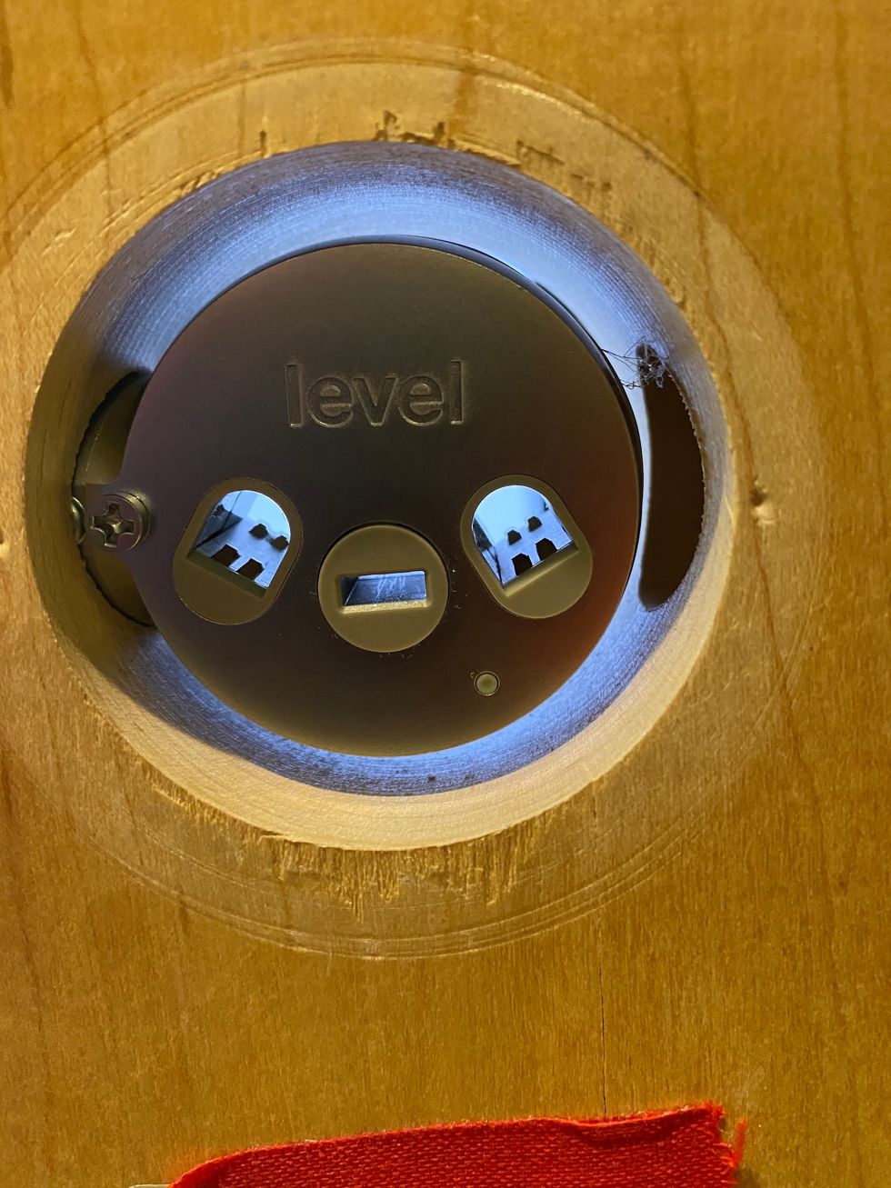 A photo of the Level Bolt inside a door hole.