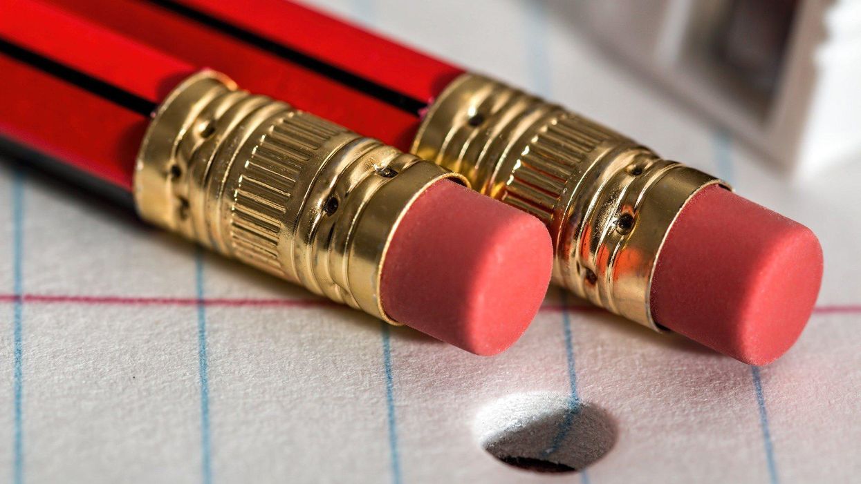 two red pencils on lined paper