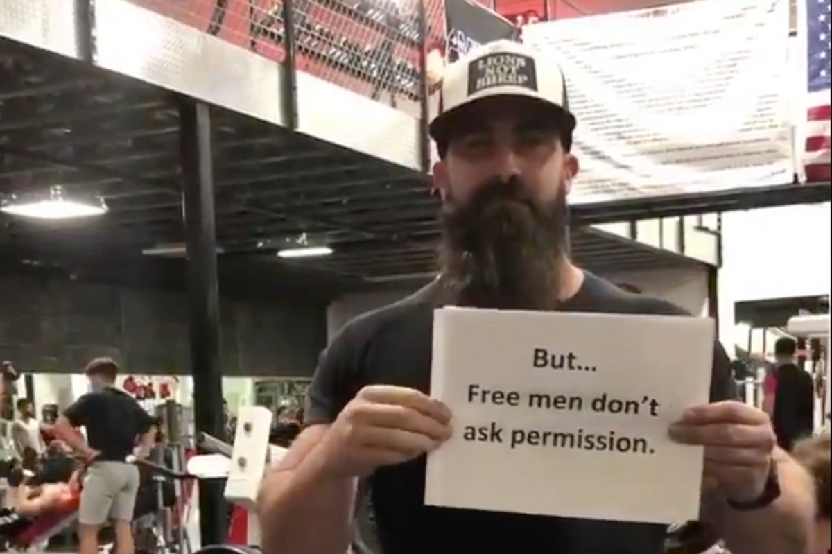 Big Tough Gym Guy Reenacts 'Love Actually' Scene To Protest COVID Restrictions