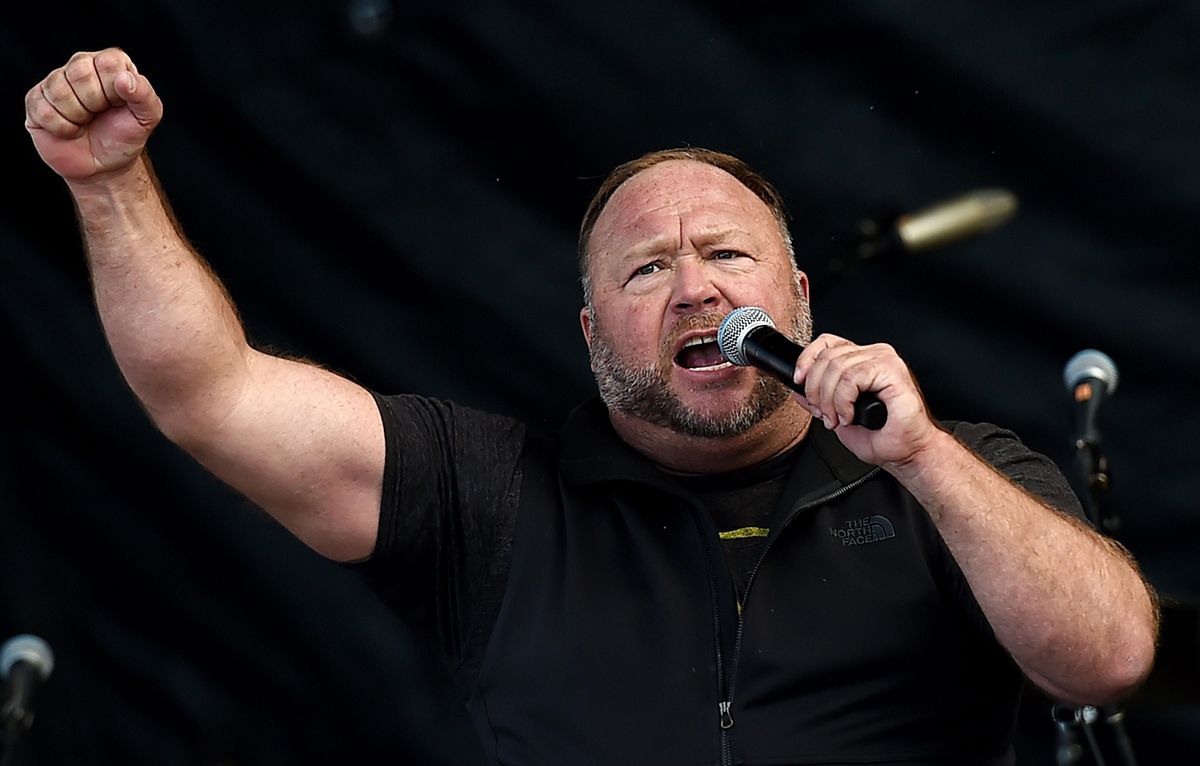 Alex Jones Tells Cheering Crowd Biden 'Will Be Removed, One Way Or Another' In Alarming Video