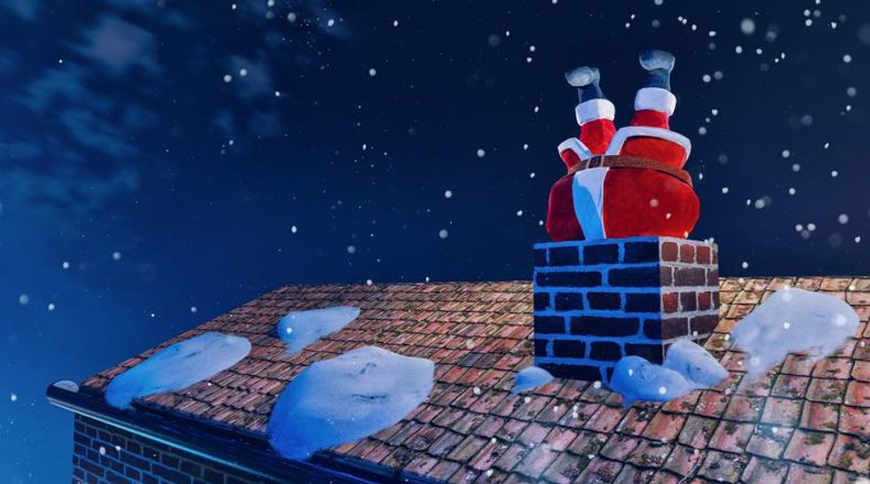 Santa upside down in a chimney