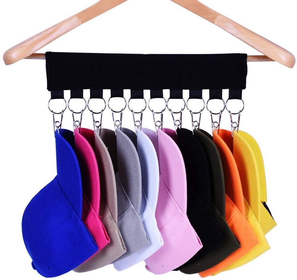Hat clips holds a variety of colored hats on a clothes hanger.