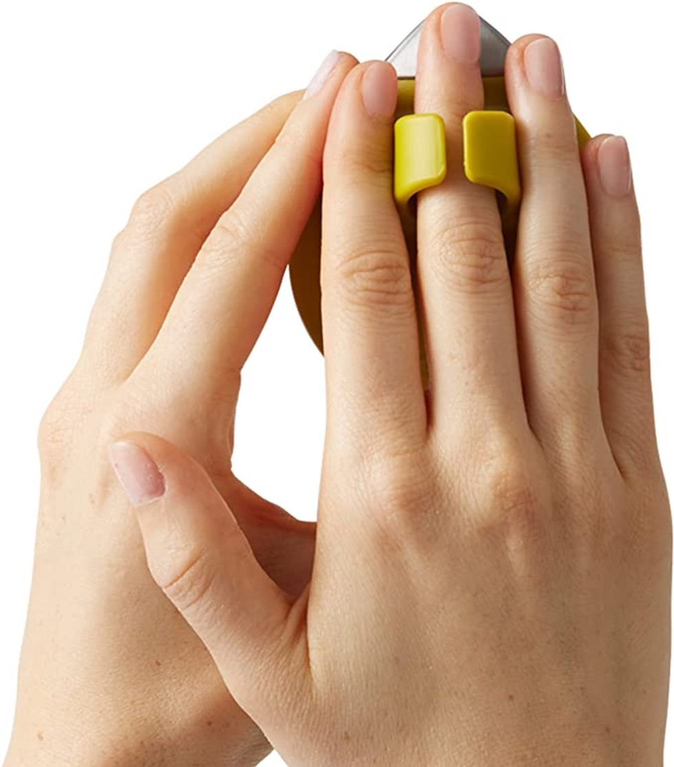 A veggie peeler that is easily put on a finger.