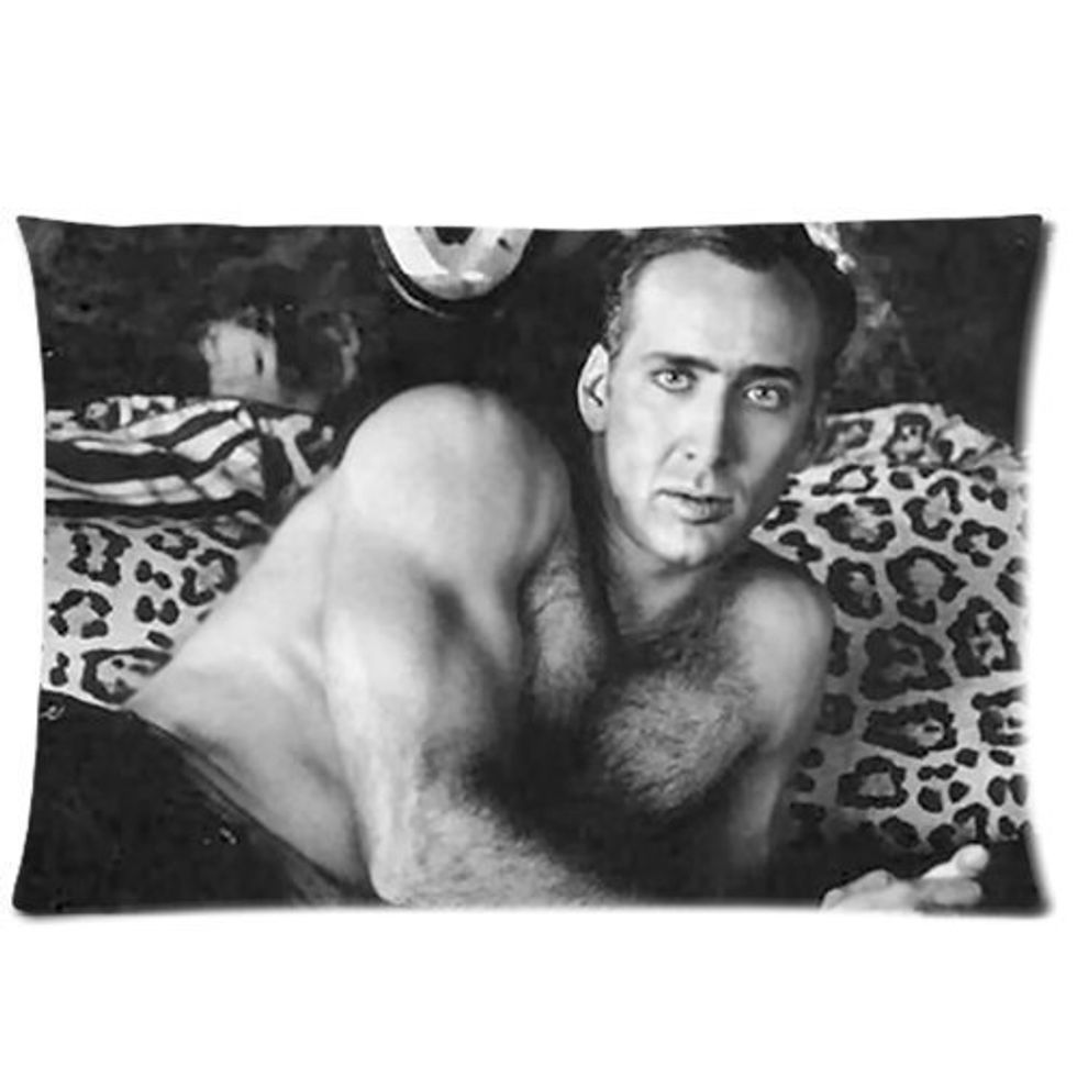 A pillowcase with a shirtless Nicolas Cage on it.