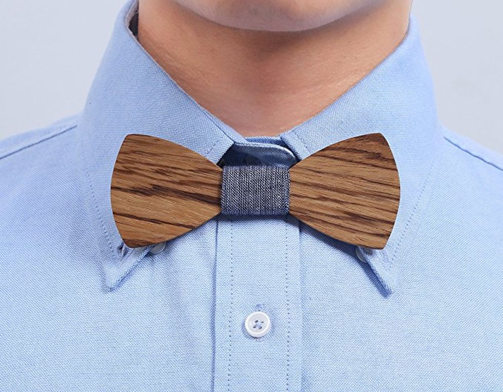 A man wearing a wooden bowtie.