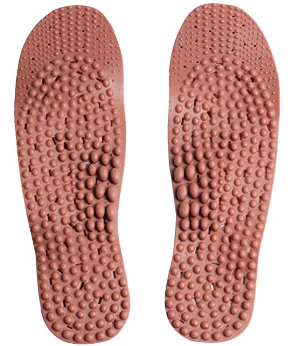 A pair of red clay insoles that massage feet while you walk.