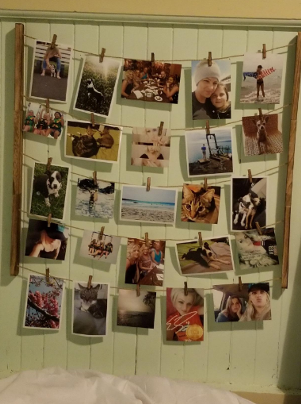 A creative photo display using string and clothing pins.