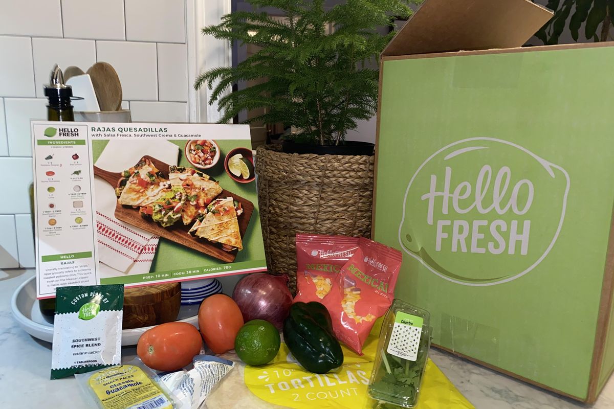 HelloFresh box, ingredients, and recipe on kitchen counter