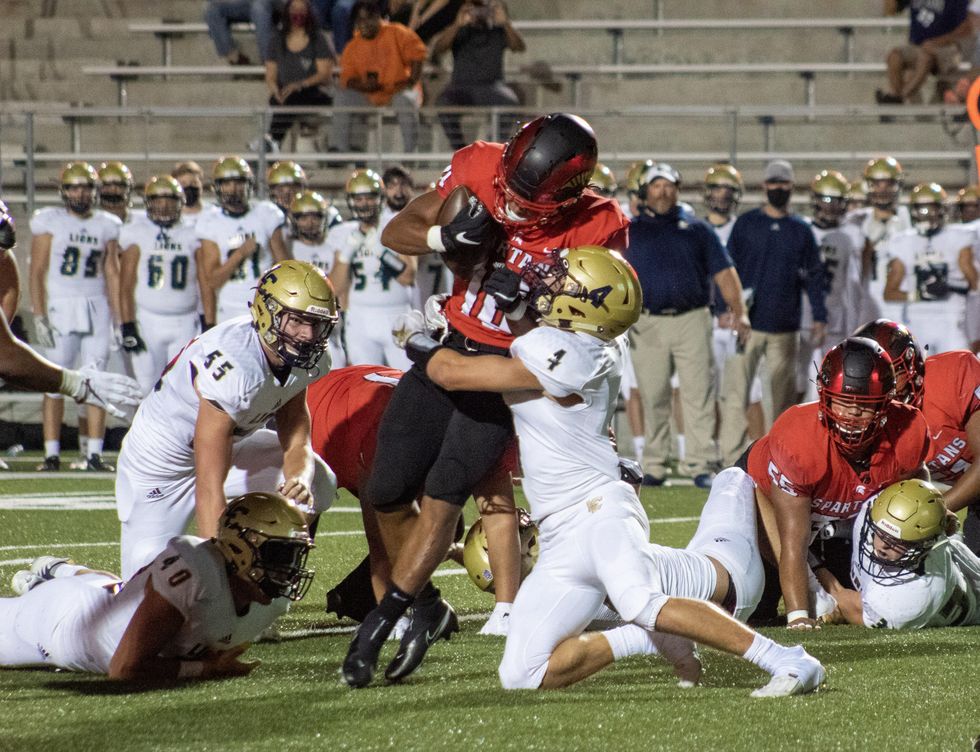 Joshua Evans-Pickens, #10 refuses to be brought down by the Lake Creek defense.