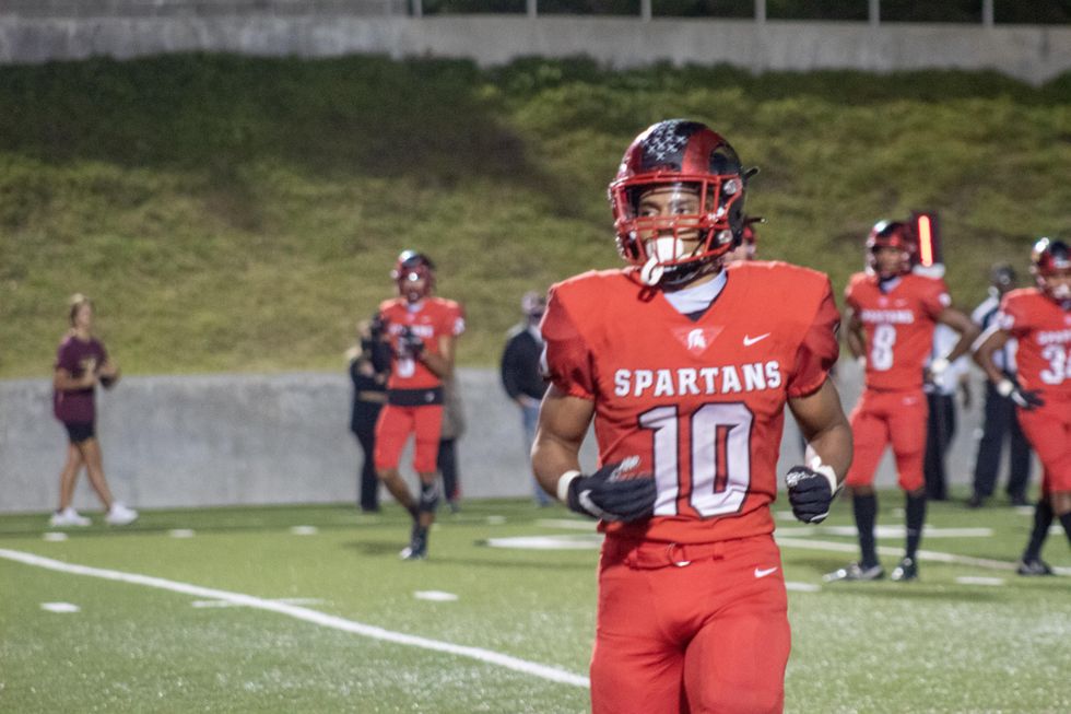 Josh Evans-Pickens, #10 jogs off the field.