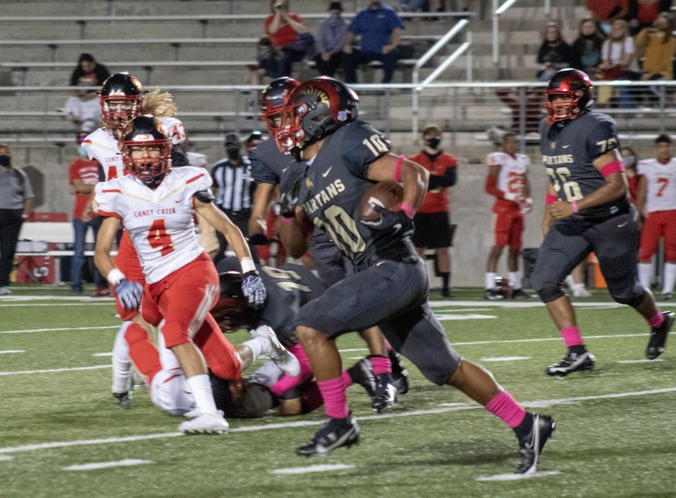 Josh Evans-Pickens makes his way past, and is left untouched by Caney Creek.