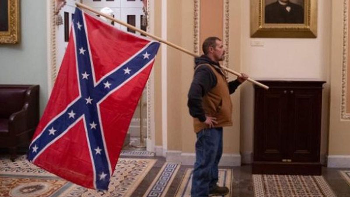 Trump supporter who brought Confederate flag into Capitol arrested in Delaware