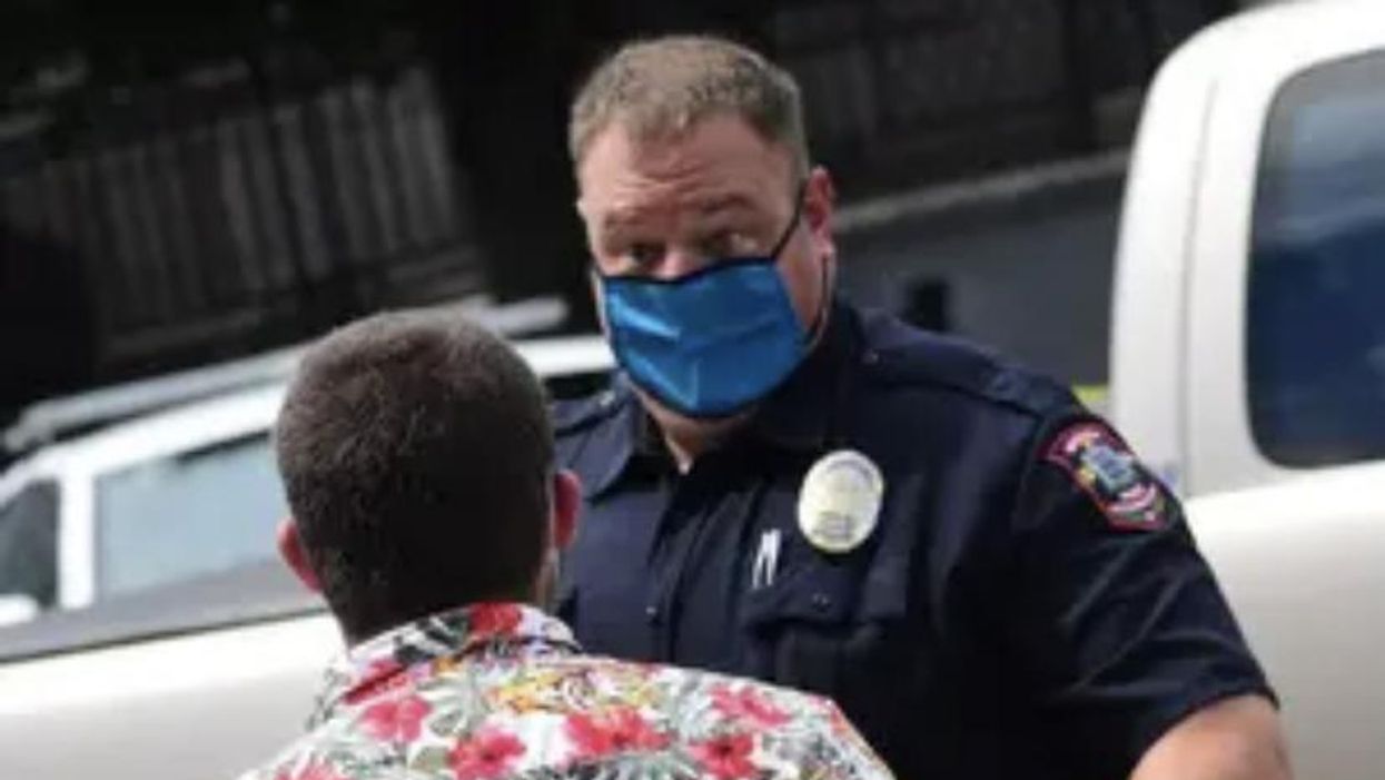 Man talks to police officer 