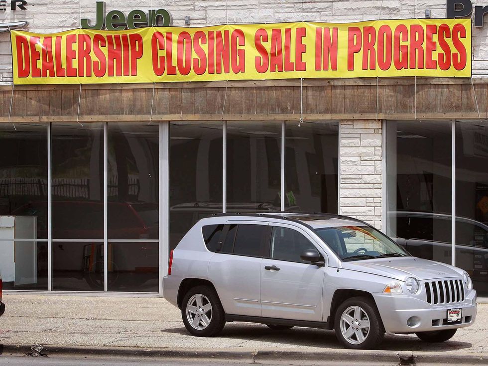 A Jeep sits in front of the empty showroom at Premier Chrysler June 8, 2009 in Chicago, Illinois. The dealership is 1 of the 789 Chrysler dealerships nationwide that are scheduled to close tomorrow. Today the Supreme Court delayed Chrysler\ufffds sale of most of its assets to a group led by Italy\ufffds Fiat. (