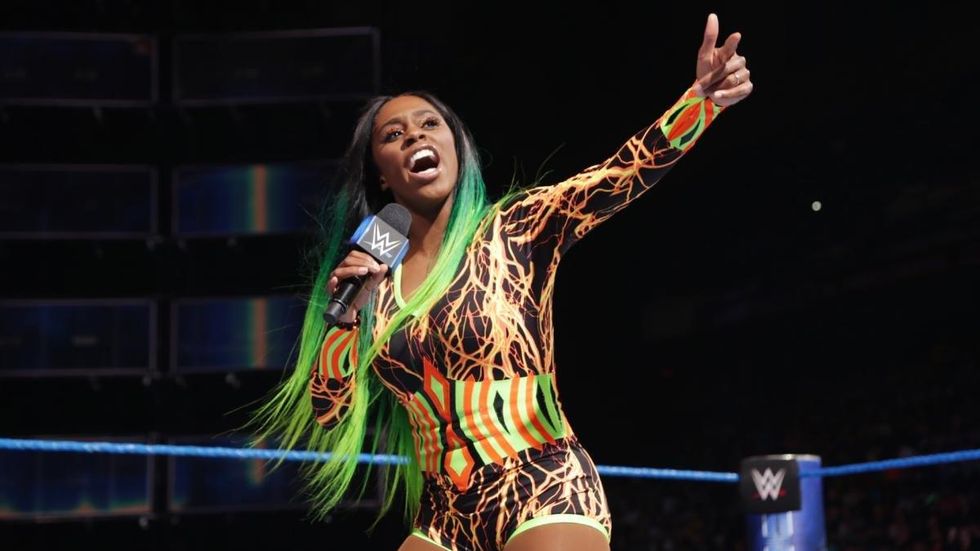 Naomi cutting a promo in the ring