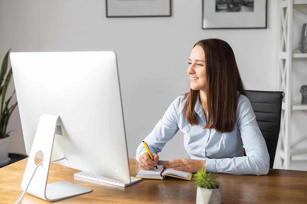 Young job seekers researches companies they she may want to apply to for a job.