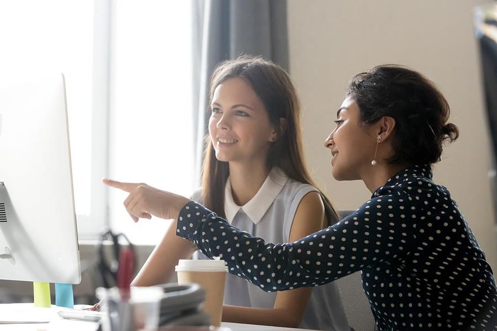 Intern learns how to do something at her job