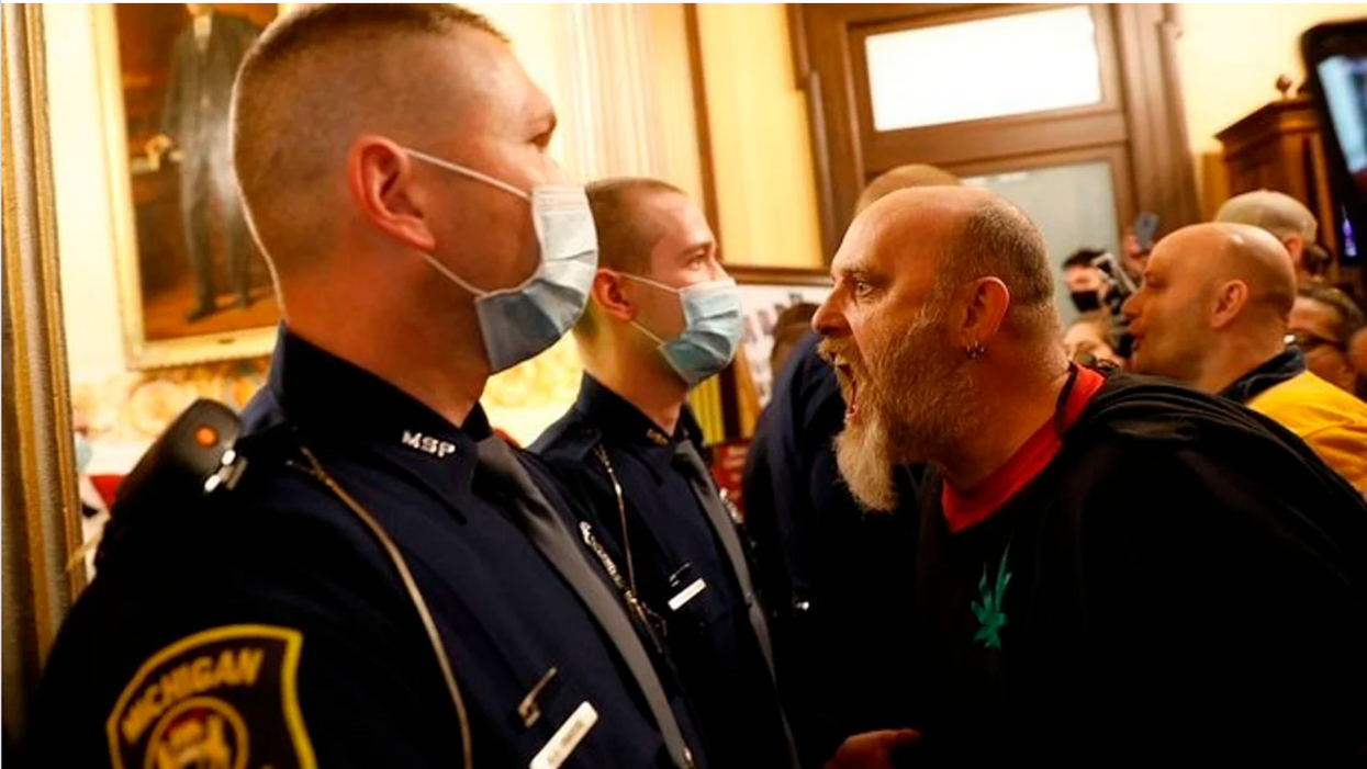 Michigan militia harassing police at state Capitol.