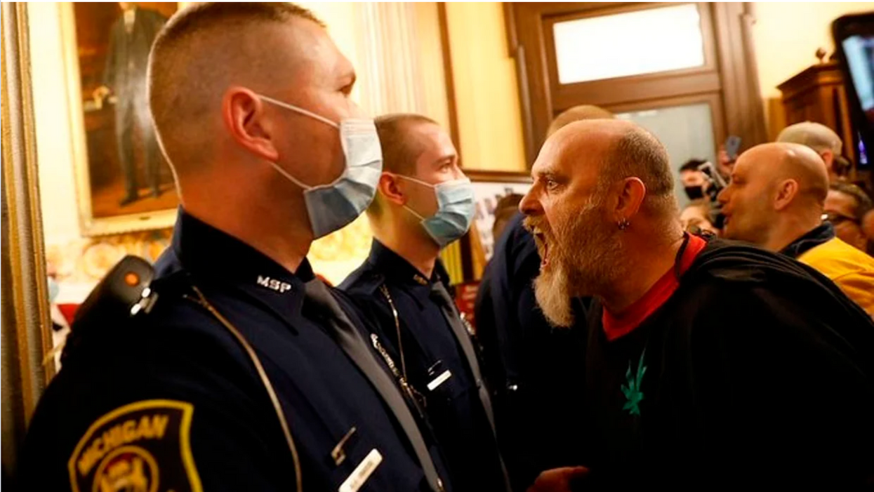 Michigan militia harassing police at  state Capitol. 